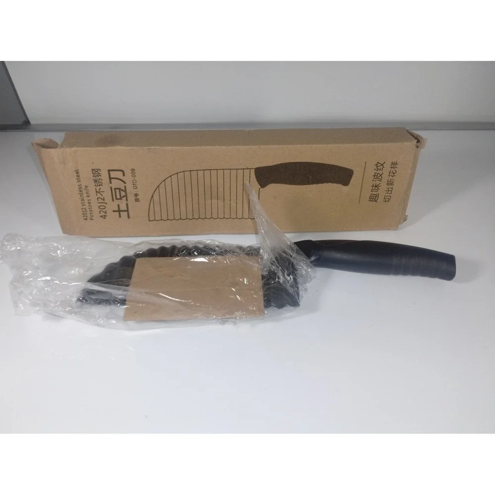 New in box potato knife black wavy